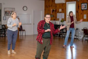 Older adults practicing tai chi as a fall prevention technique for Fall Prevention Awareness Week